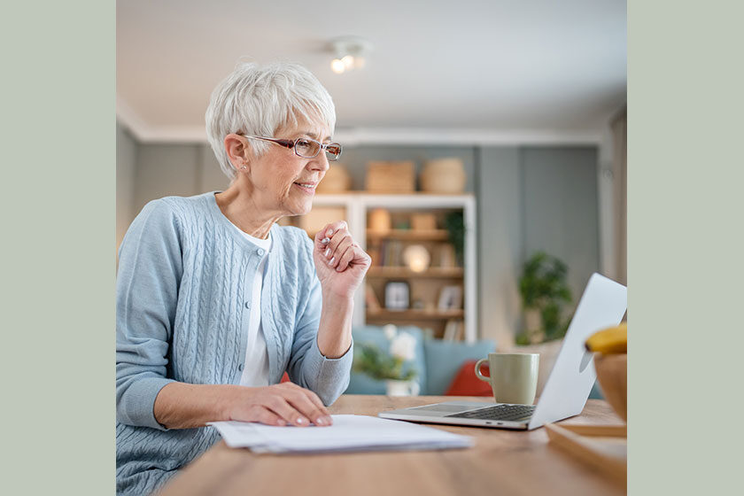 Senior caucasian woman use laptop computer at home for work